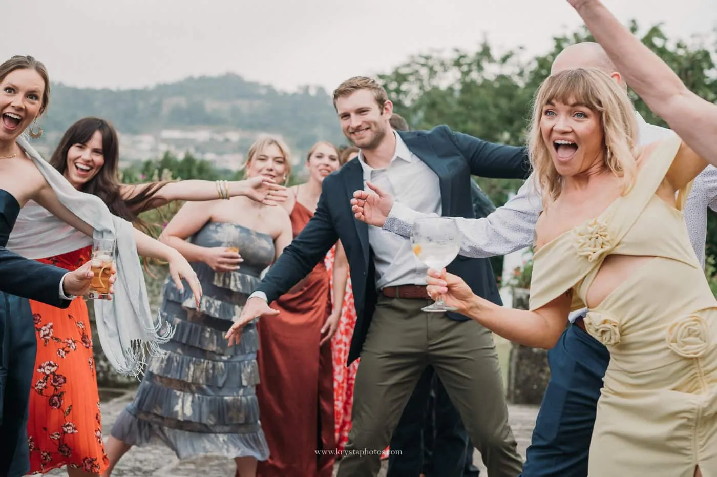 wedding guests enjoying cocktail hour during an intimate vineyard wedding
