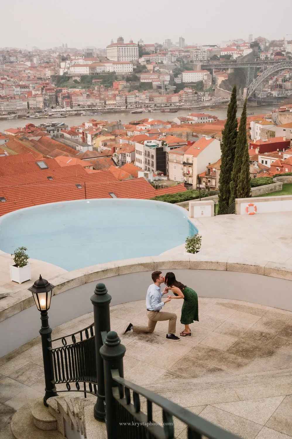 Couple saying yes to engagement with stunning Porto skyline backdrop and Douro River views